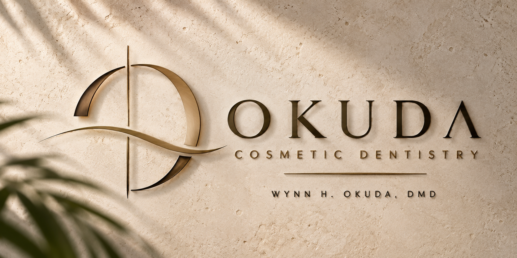 Okuda Cosmetic Dentistry brand mark in warm stone and brass